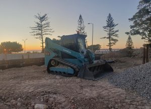 Levelling and moving material